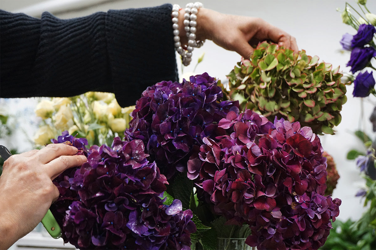 Modern corporate floral arrangement prepared for a Toronto office delivery