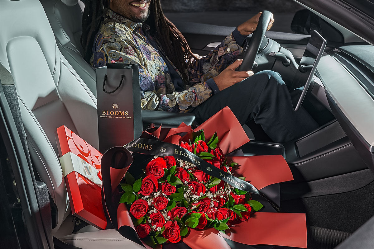 Man having Toronto Blooms gifts in the car