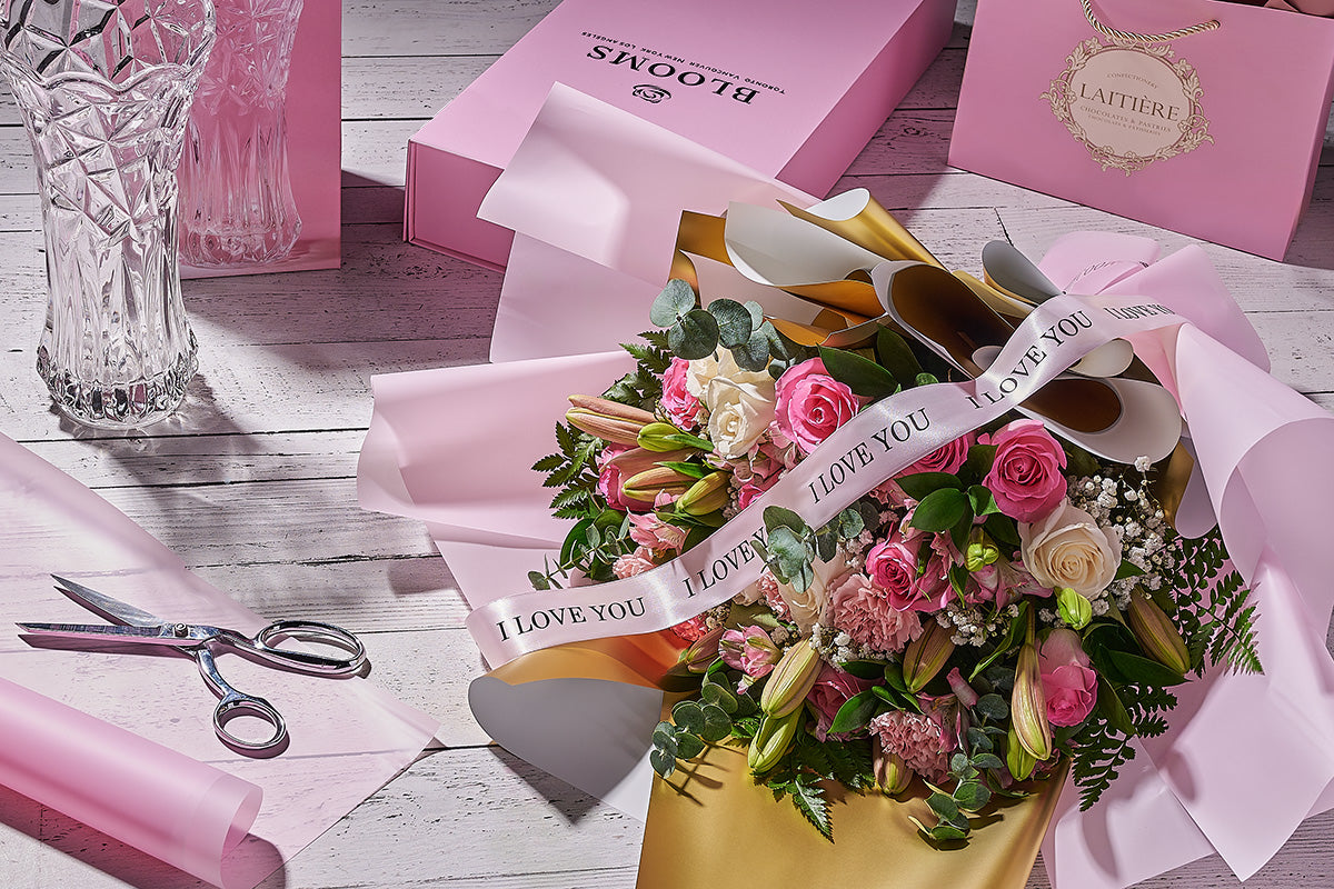 Florist hand-designing a custom bouquet in a Toronto studio