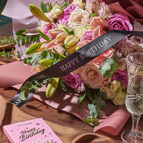 happy birthday ribbon with a pink and white arrangement flowers by toronto blooms with