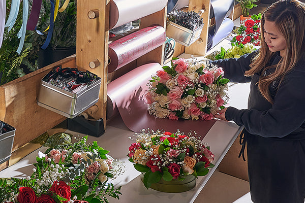 Bouquet being wrapped for safe flower delivery