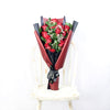 This bouquet includes a selection of deep red roses, baby’s breath, and ruscus gathered in floral wrap with designer ribbon.