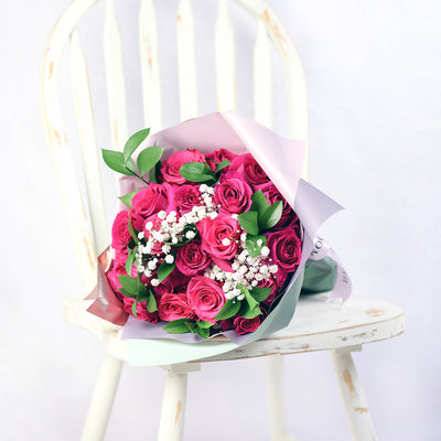 bouquet with pink roses, ruscus and baby's breath wrapped in floral wrap and designer ribbon, Same Day Toronto Delivery