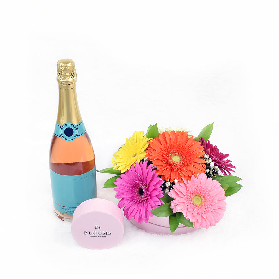 Daisy floral arrangement with champagne and chocolate truffles. Same Day Toronto Delivery.