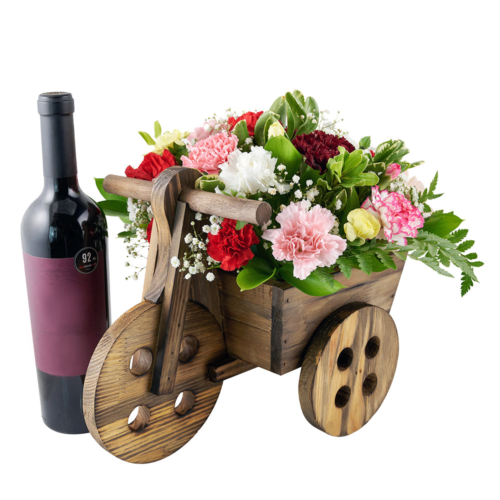 Carnation floral arrangement in a wooden cart planter. Same Day Toronto Delivery.